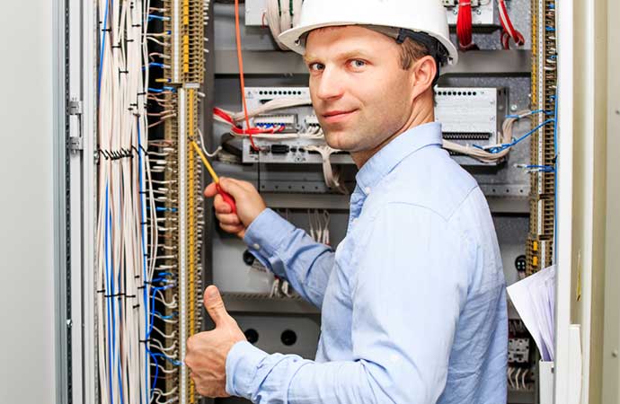An ICS technician performing industrial electrical services in Atlanta
